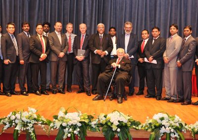Winners of the International Best Practice Competition in Abu Dhabi, 2014 on stage with Jim Harrington & the judges